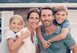 Happy family hugging after a counseling session